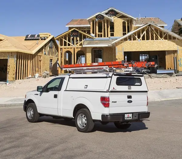 commercial truck cap in front of house in construction